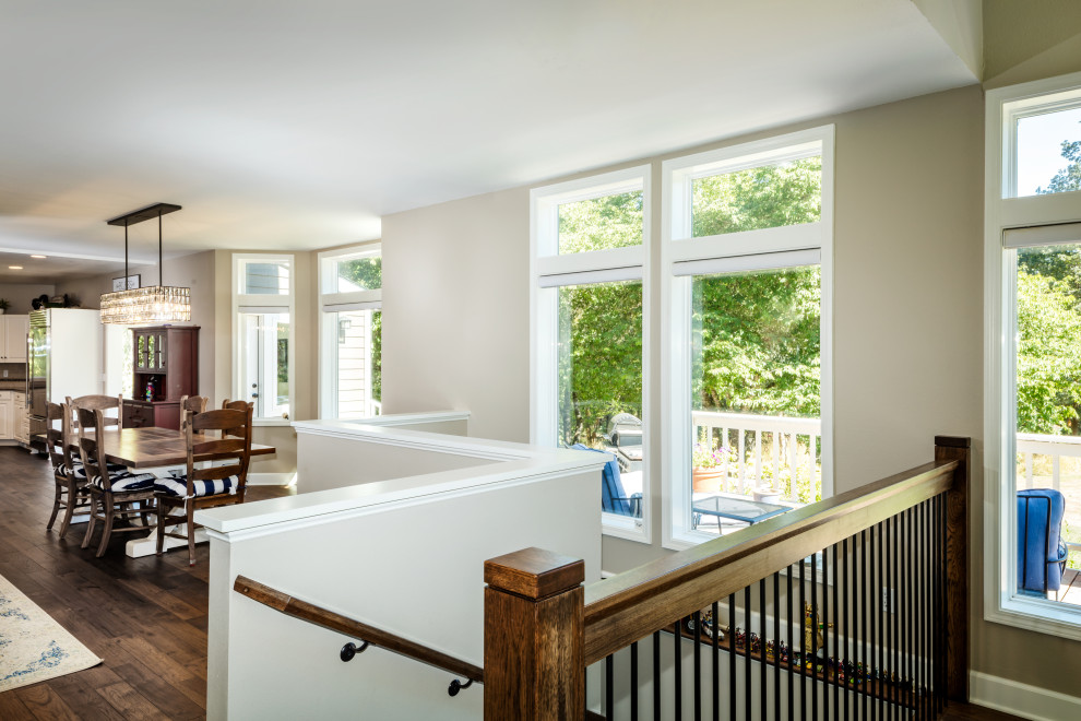 Mid-sized mountain style medium tone wood floor and brown floor breakfast nook photo with white walls and no fireplace