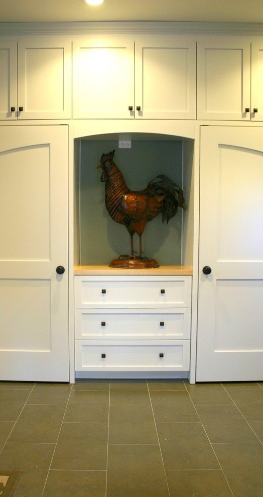 Mudroom - mid-sized transitional ceramic tile mudroom idea with a white front door and beige walls