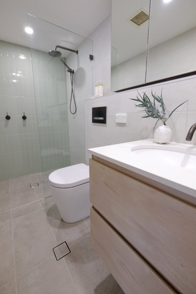 Design ideas for a small industrial bathroom in Sydney with flat-panel cabinets, light wood cabinets, an open shower, a wall-mount toilet, white tile, porcelain tile, white walls, porcelain floors, a drop-in sink, quartzite benchtops, grey floor, an open shower, white benchtops, a single vanity and a floating vanity.