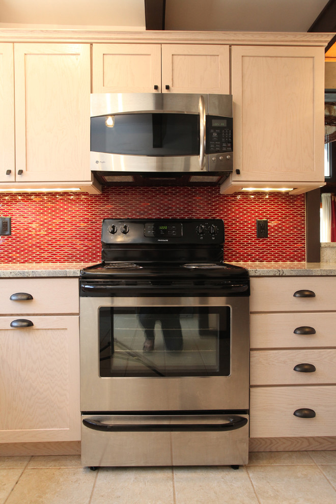 Kitchen - transitional ceramic tile kitchen idea in New York with an undermount sink, shaker cabinets, light wood cabinets, granite countertops, red backsplash, ceramic backsplash and stainless steel appliances