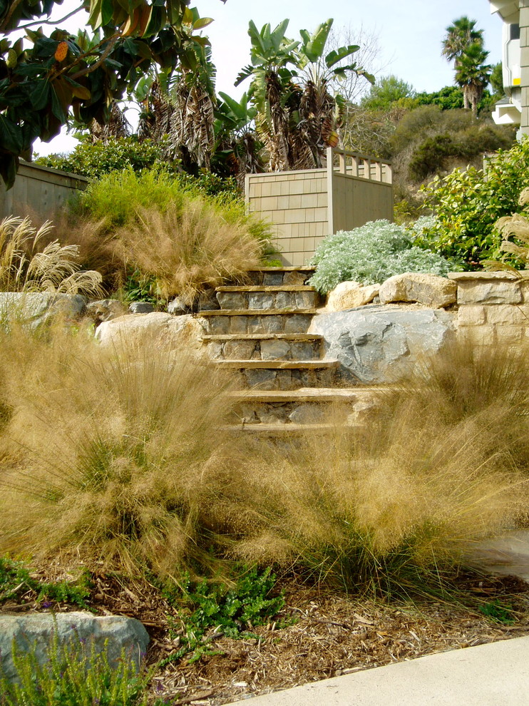 This is an example of an arts and crafts xeriscape in San Diego with with rock feature.