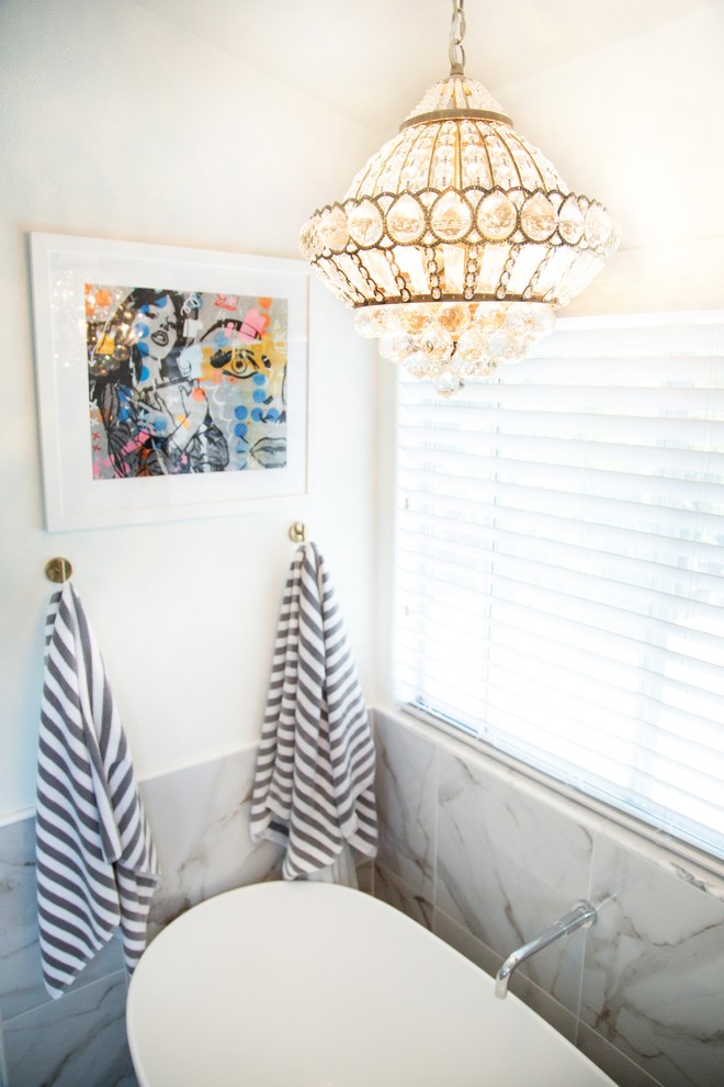 Inspiration for a mid-sized transitional 3/4 white tile and porcelain tile freestanding bathtub remodel with raised-panel cabinets, white cabinets, a two-piece toilet, white walls, an undermount sink, solid surface countertops and a hinged shower door