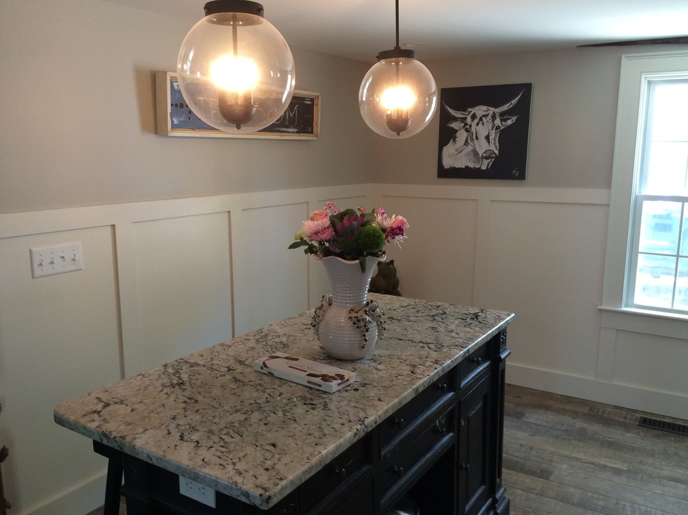 Inspiration for a transitional medium tone wood floor kitchen remodel in Boston with an island