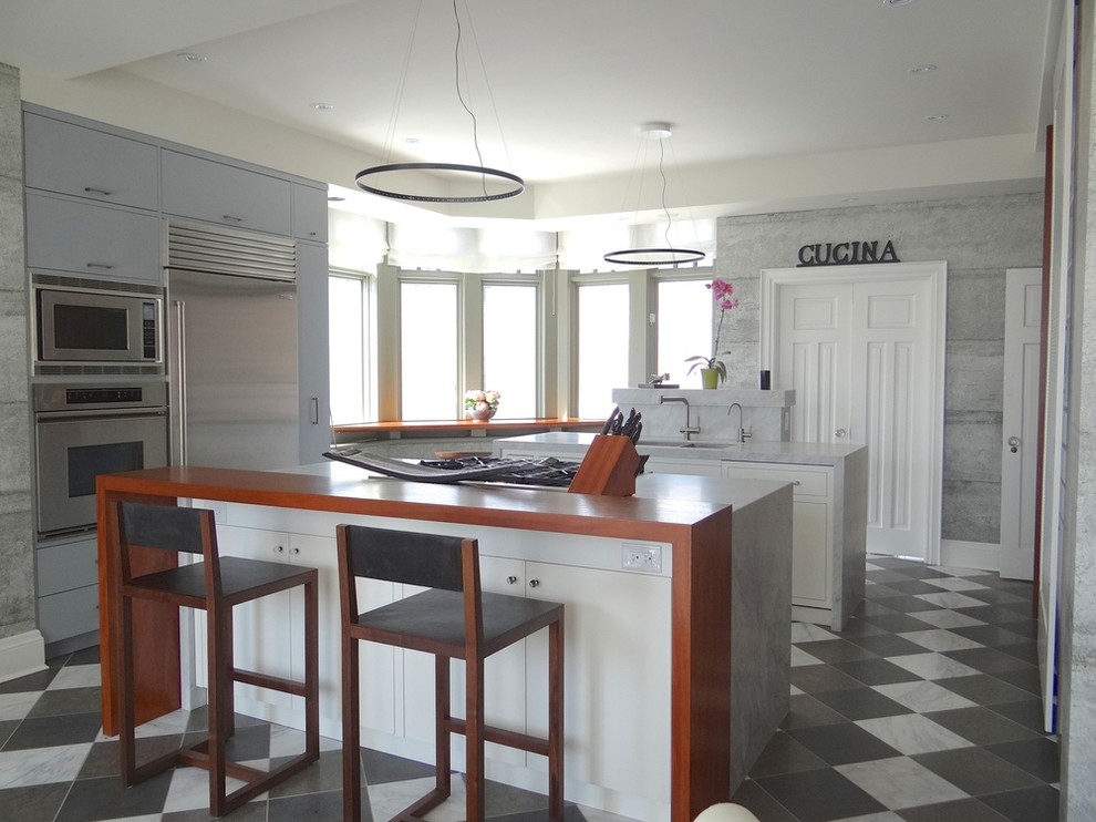 Eat-in kitchen - transitional single-wall marble floor eat-in kitchen idea in Toronto with a double-bowl sink, flat-panel cabinets, blue cabinets, marble countertops, stainless steel appliances and two islands