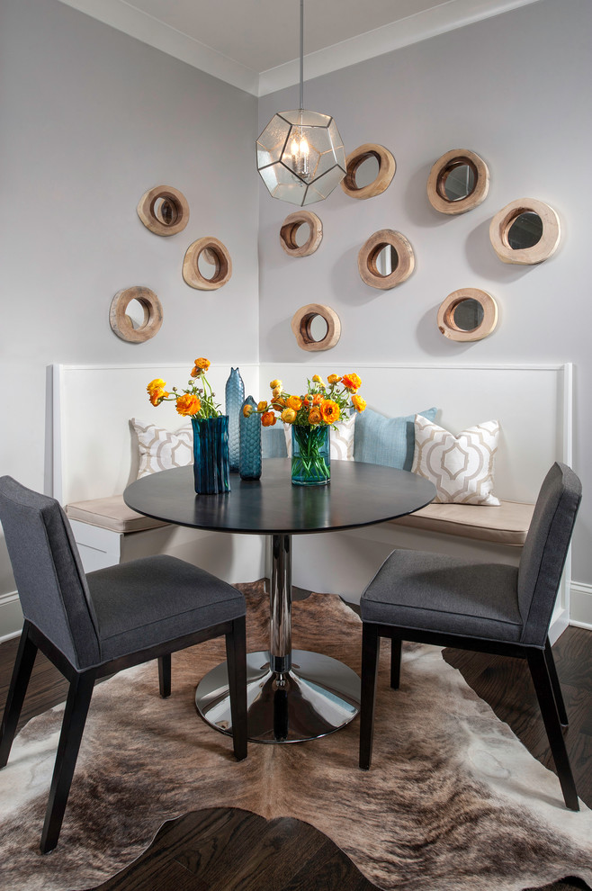 Photo of a transitional dining room in Chicago with grey walls and dark hardwood floors.
