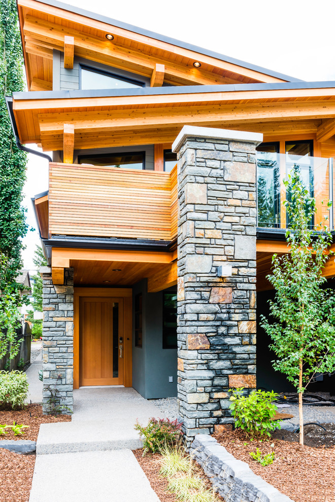 Example of a mountain style home design design in Vancouver