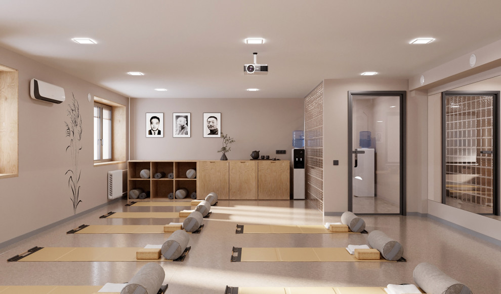 Cette image montre un studio de yoga design de taille moyenne avec un mur beige, un sol en liège et un sol beige.