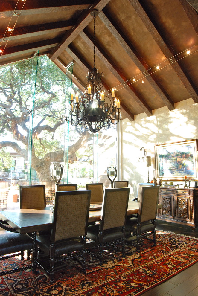 Large mountain style dark wood floor enclosed dining room photo in Austin with brown walls and no fireplace