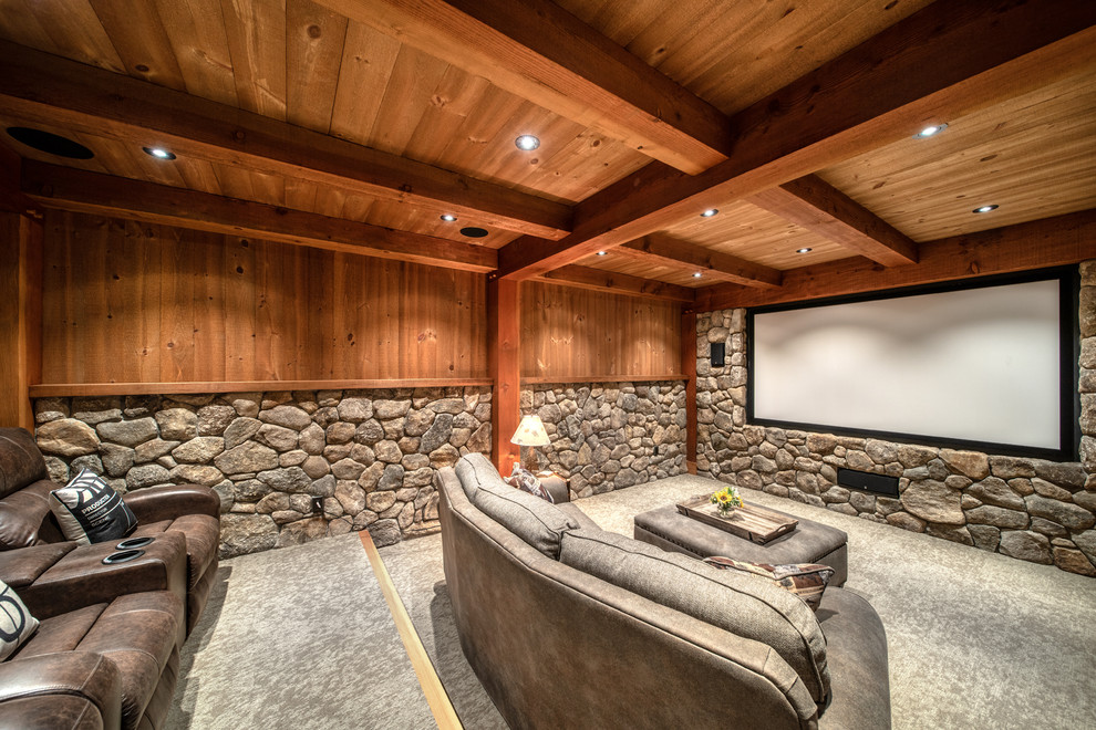 Inspiration for a country home theatre in Boston with brown walls, carpet, a projector screen and grey floor.