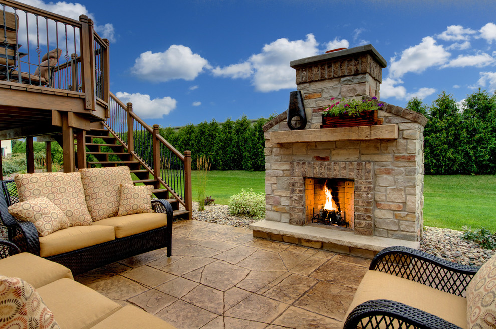 Inspiration for a traditional patio in Other with a fire feature and concrete pavers.