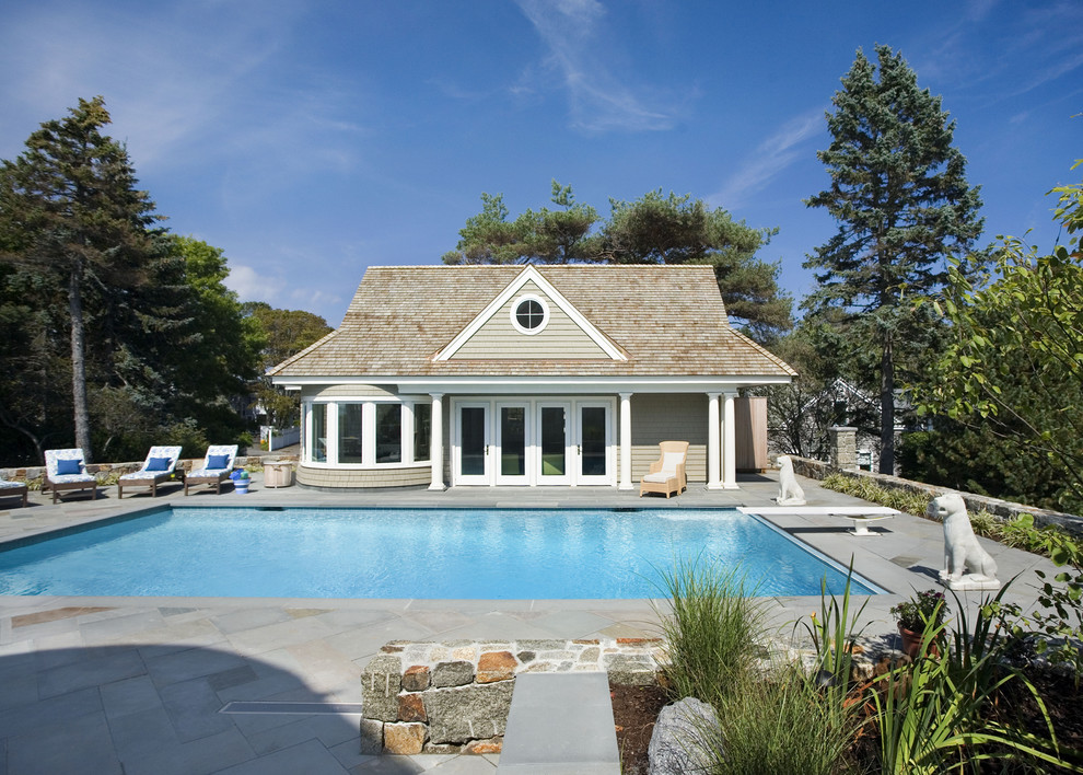 Photo of a traditional rectangular pool in Boston with a pool house.