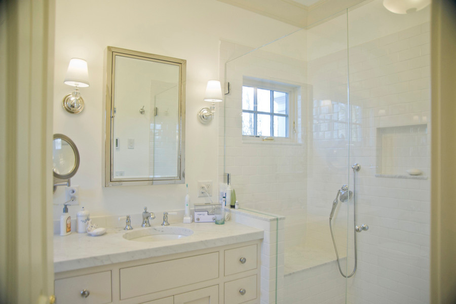 This is an example of a mid-sized traditional master bathroom in Boston with an undermount sink, beaded inset cabinets, white cabinets, marble benchtops, an undermount tub, an open shower, a two-piece toilet, white tile, ceramic tile, white walls and ceramic floors.