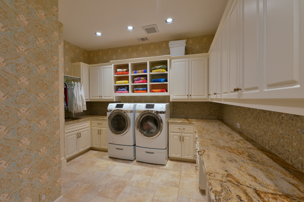 Expansive traditional u-shaped utility room in Austin with a single-bowl sink, raised-panel cabinets, white cabinets, laminate benchtops, multi-coloured walls, porcelain floors and a side-by-side washer and dryer.