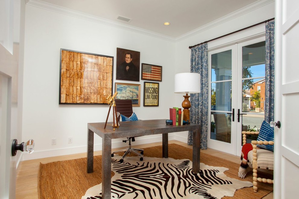 Photo of a traditional home office in Orange County with white walls.