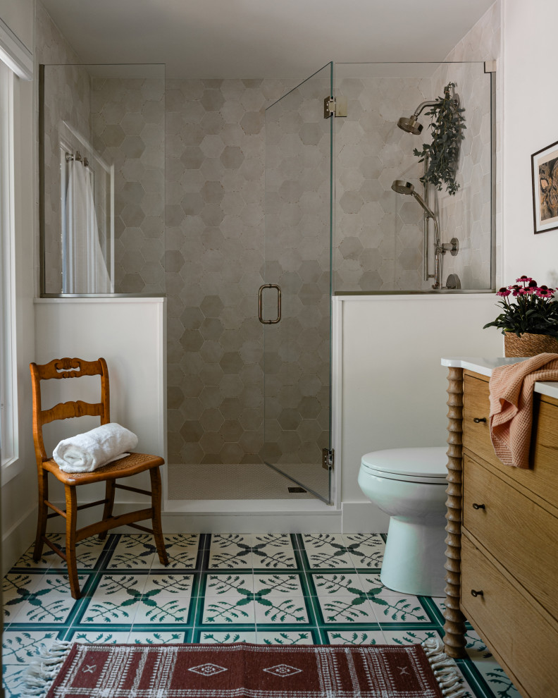 Inspiration for a mid-sized transitional kids' white tile and cement tile cement tile floor, green floor and single-sink alcove shower remodel in Chicago with flat-panel cabinets, light wood cabinets, a one-piece toilet, white walls, an undermount sink, quartz countertops, a hinged shower door, white countertops and a freestanding vanity