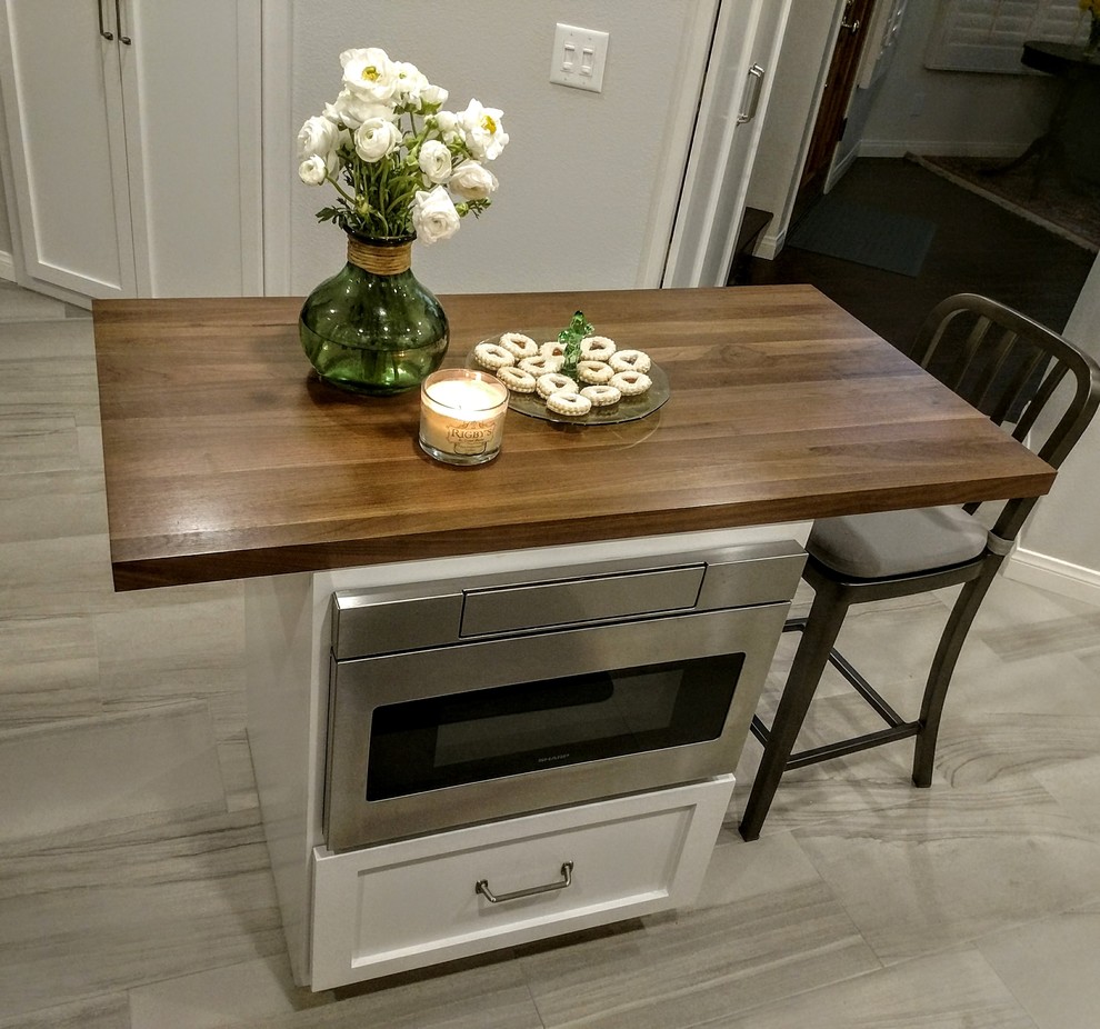 Kitchen - transitional porcelain tile and gray floor kitchen idea in Orange County with an undermount sink, shaker cabinets, white cabinets, quartz countertops, gray backsplash, subway tile backsplash and stainless steel appliances