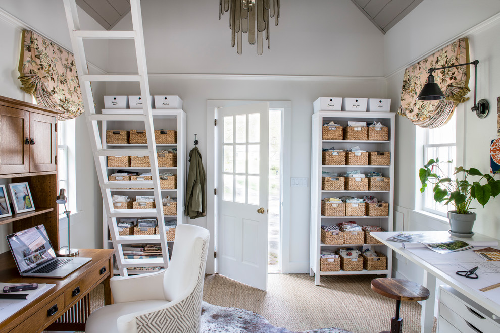 Inspiration for a small transitional home office in Boston with white walls, carpet, a freestanding desk and brown floor.