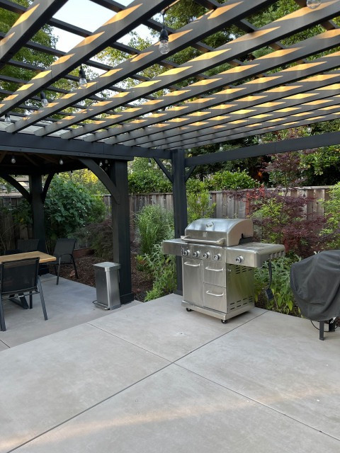 Backyard remodel, including overhead structures, spa, and trampoline