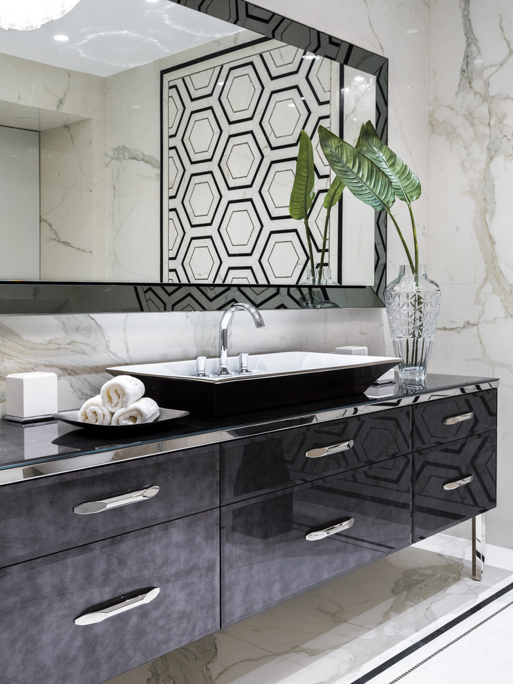 Design ideas for a contemporary powder room in Moscow with flat-panel cabinets, black cabinets, beige walls, a vessel sink, glass benchtops and beige floor.