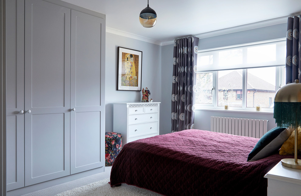 Design ideas for a transitional master bedroom in London with grey walls, carpet and grey floor.