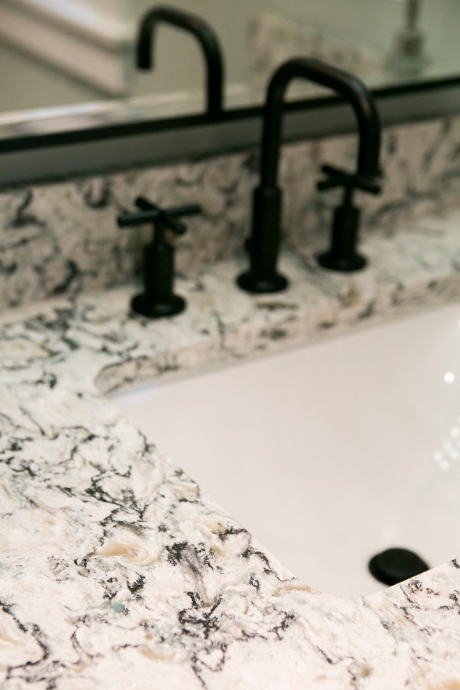 Large transitional master black and white tile and subway tile porcelain tile, black floor and double-sink walk-in shower photo with shaker cabinets, black cabinets, a two-piece toilet, an undermount sink, quartz countertops, a hinged shower door, multicolored countertops and a built-in vanity