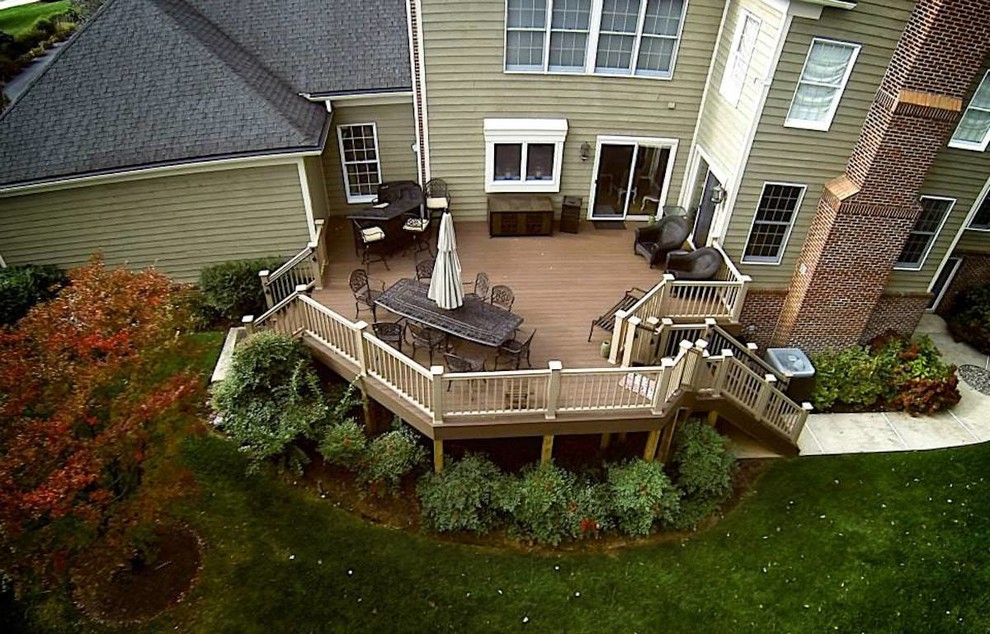Example of a large transitional backyard outdoor kitchen deck design in Baltimore with no cover