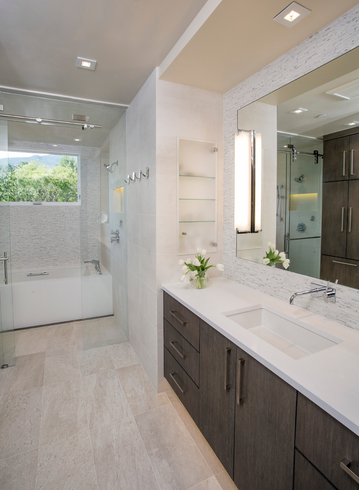 Design ideas for a large contemporary master bathroom in Denver with an integrated sink, flat-panel cabinets, medium wood cabinets, solid surface benchtops, a curbless shower, a two-piece toilet, white tile, matchstick tile, white walls and an alcove tub.