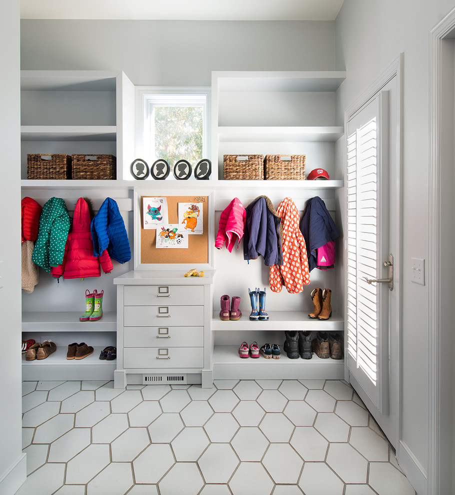 Photo of a transitional mudroom in DC Metro with white walls.