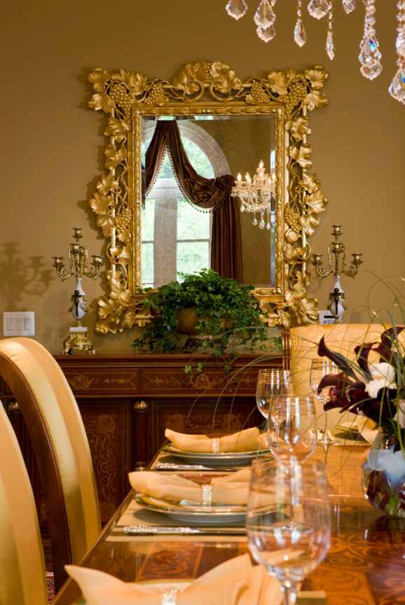 Inspiration for a mid-sized transitional medium tone wood floor and brown floor enclosed dining room remodel in DC Metro with yellow walls and no fireplace