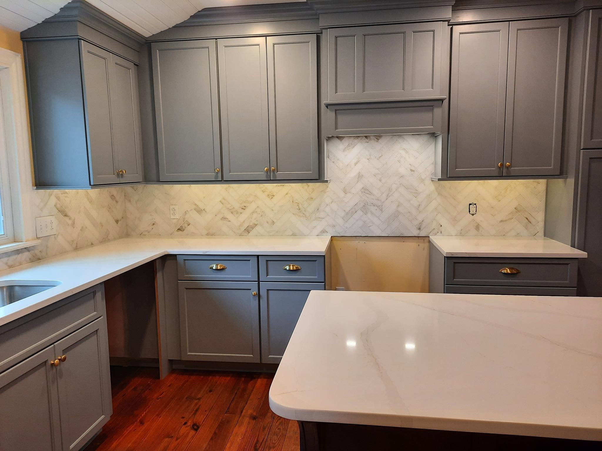 Quartz tops Marble herringbone splash