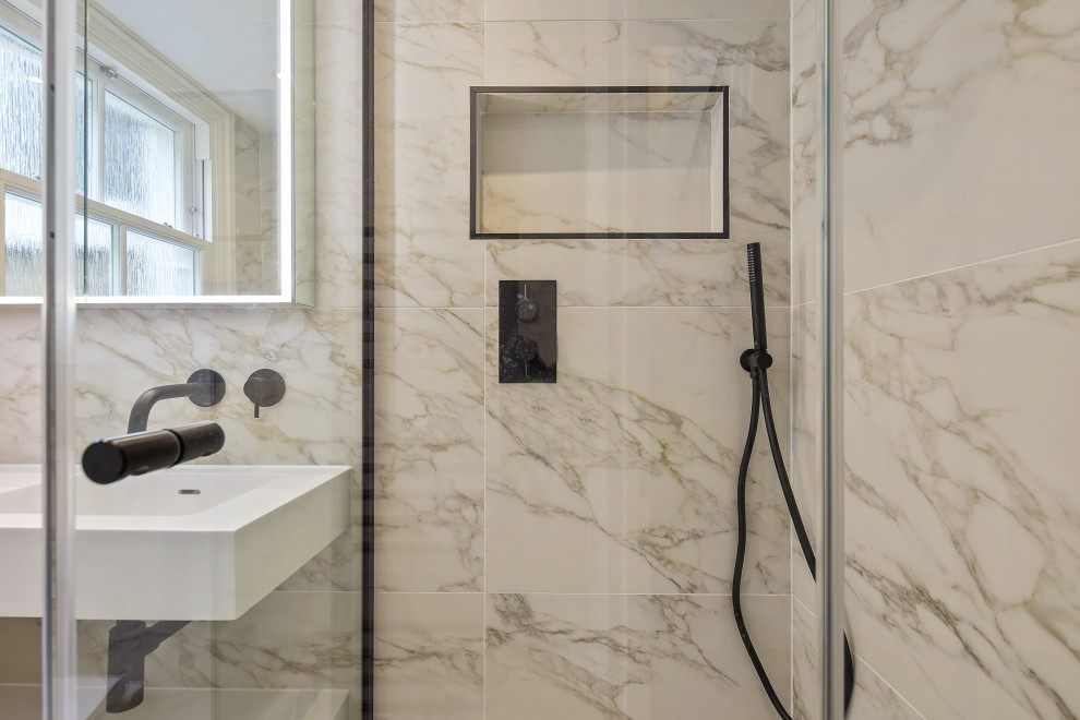 Inspiration for a small contemporary bathroom in London with a freestanding bath, a corner shower, a wall mounted toilet, porcelain tiles and porcelain flooring.