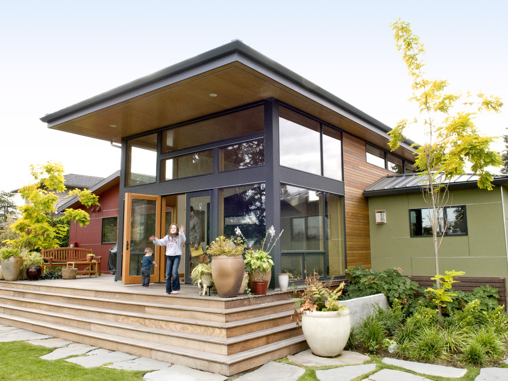 This is an example of a mid-sized contemporary two-storey exterior in Seattle with wood siding.