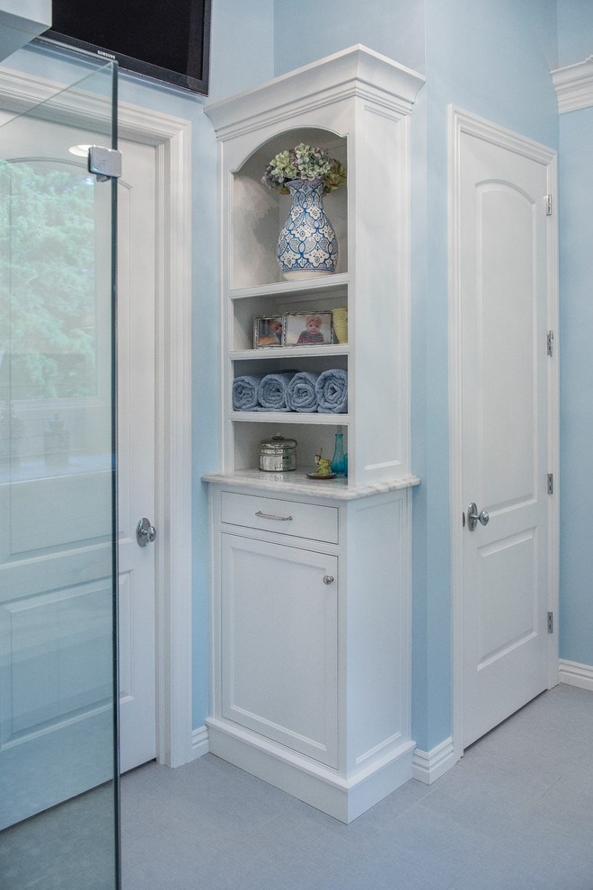Inspiration for a mid-sized transitional master gray tile and porcelain tile porcelain tile corner shower remodel with beaded inset cabinets, white cabinets, quartz countertops, blue walls and an undermount sink