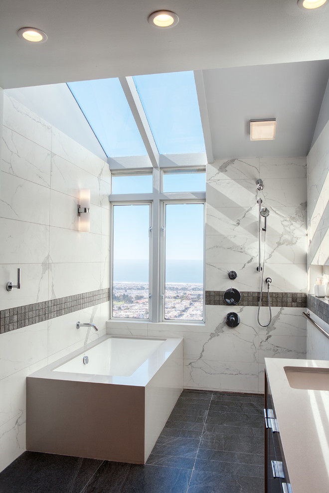 Inspiration for a huge modern master white tile and porcelain tile porcelain tile and gray floor doorless shower remodel in San Francisco with flat-panel cabinets, gray cabinets, an undermount tub, a wall-mount toilet, white walls, an undermount sink, quartz countertops and white countertops