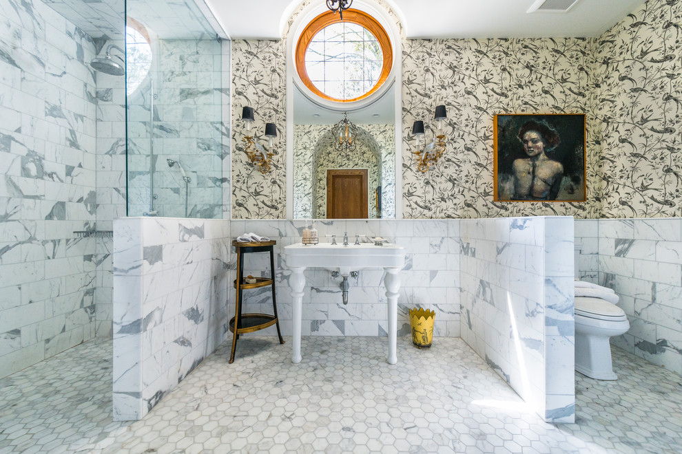 Photo of a mid-sized master bathroom in Atlanta with white cabinets, an open shower, multi-coloured tile, marble floors, multi-coloured walls, a pedestal sink, an open shower and grey floor.