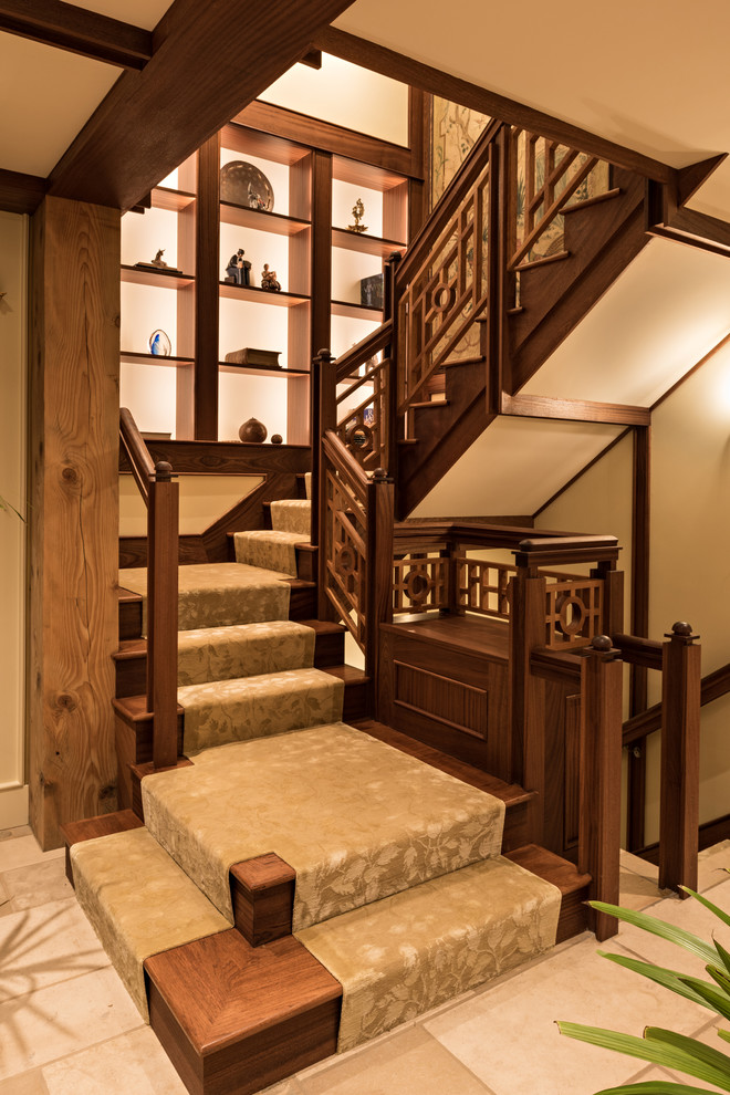 Photo of an asian wood u-shaped staircase in Boston with wood railing and wood risers.