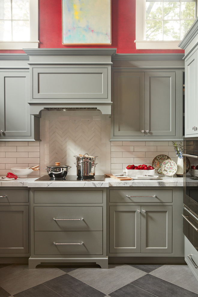 Example of a mid-sized transitional u-shaped porcelain tile and gray floor kitchen design in Boston with shaker cabinets, green cabinets, marble countertops, white backsplash, subway tile backsplash, paneled appliances and an island