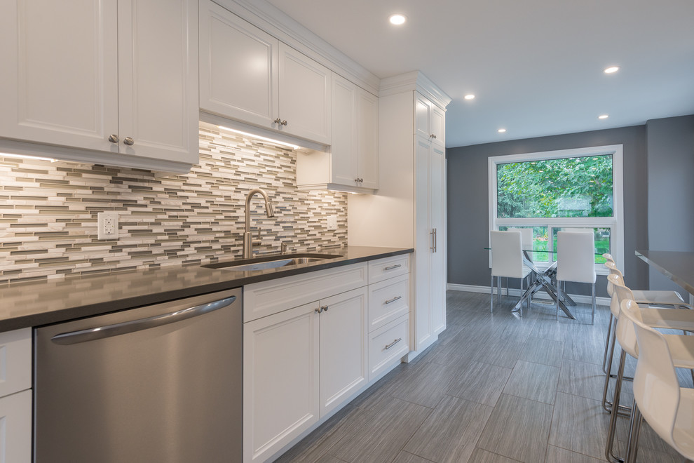 Example of a transitional kitchen design in Toronto
