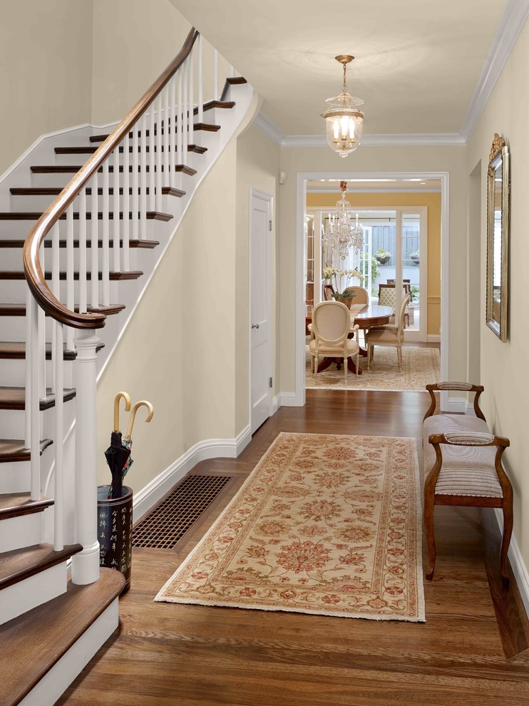 Design ideas for a mid-sized traditional hallway in San Francisco with beige walls and medium hardwood floors.