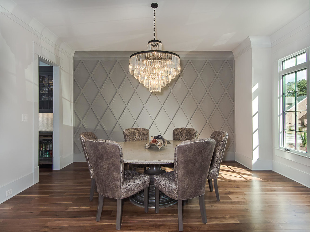 Inspiration for a mid-sized transitional dining room in Raleigh with white walls, light hardwood floors, no fireplace and beige floor.