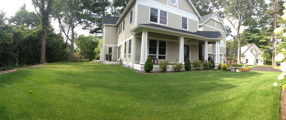 Mid-sized transitional beige two-story wood gable roof photo in Boston with a shingle roof