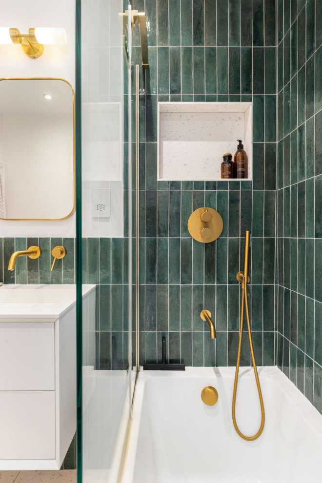 Large 1950s kids' green tile and matchstick tile multicolored floor and single-sink bathroom photo in Hampshire with flat-panel cabinets, white cabinets, a one-piece toilet, white walls, a wall-mount sink and a floating vanity