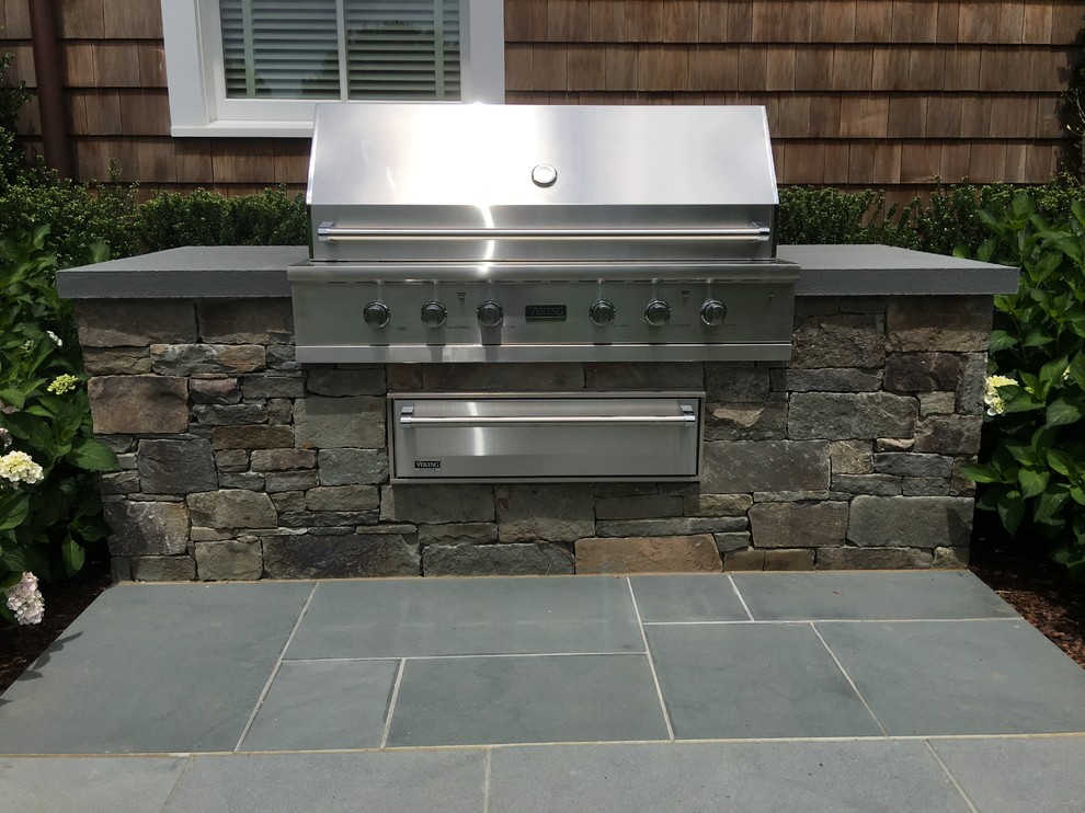 Inspiration for a large modern backyard patio in New York with an outdoor kitchen, concrete slab and no cover.