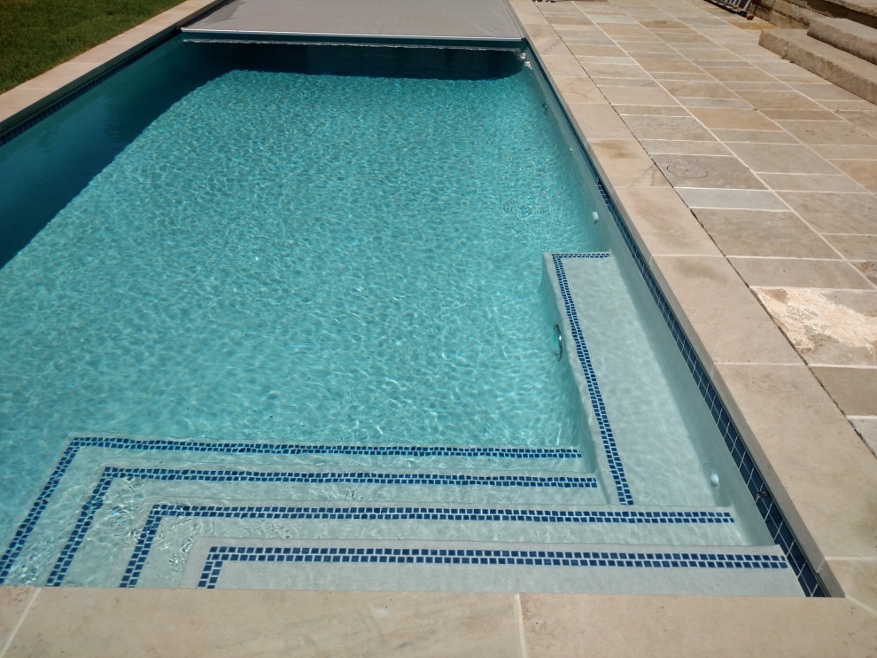 Example of a large backyard rectangular pool design in Denver