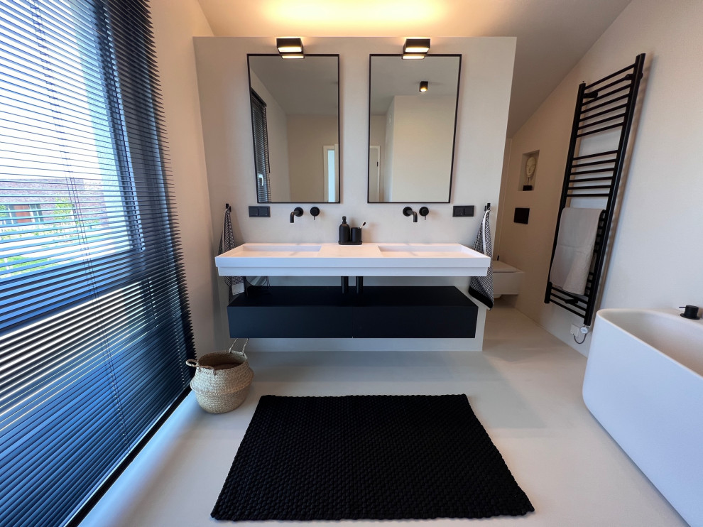 Inspiration for an expansive modern bathroom in Cologne with flat-panel cabinets, black cabinets, a built-in bath, a built-in shower, a wall mounted toilet, beige tiles, beige walls, a console sink, engineered stone worktops, beige floors, an open shower, white worktops, double sinks and a floating vanity unit.