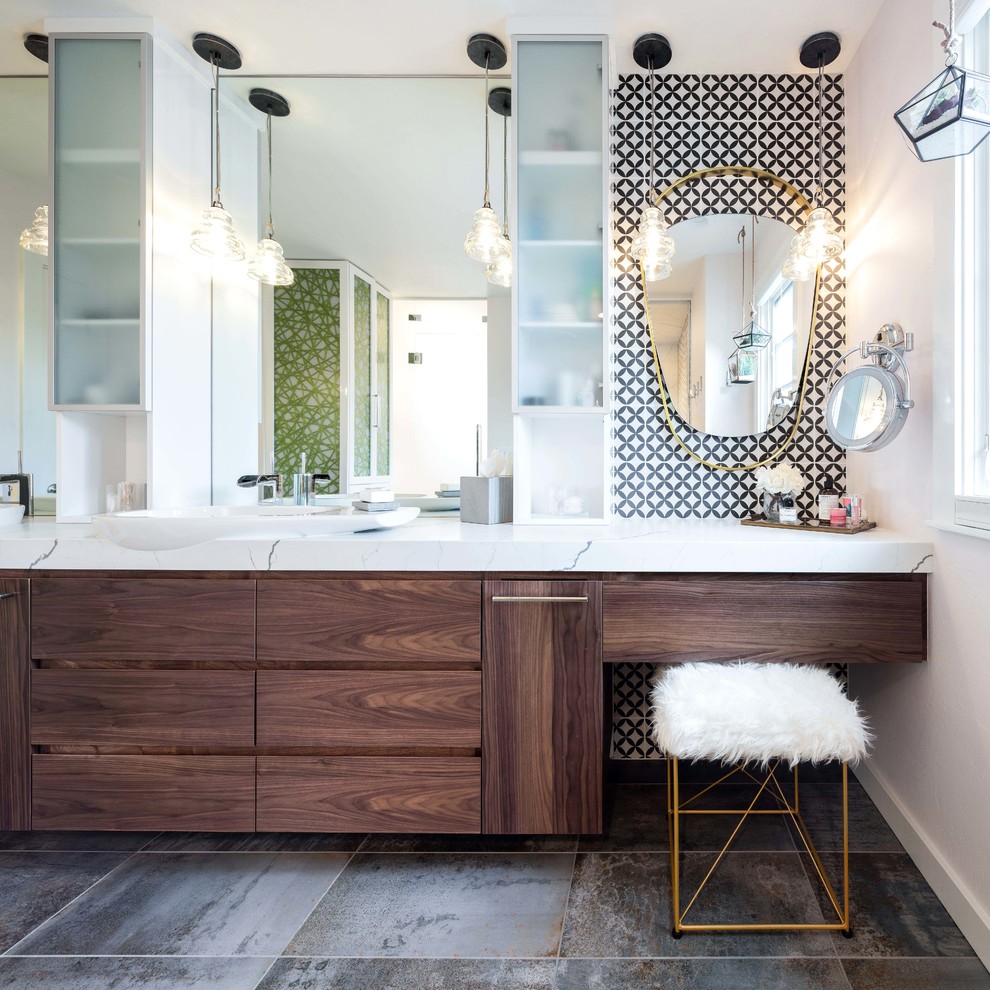 This is an example of a contemporary bathroom in Denver with dark wood cabinets, porcelain tile, quartzite benchtops, flat-panel cabinets, black and white tile, white walls, a vessel sink, grey floor and white benchtops.