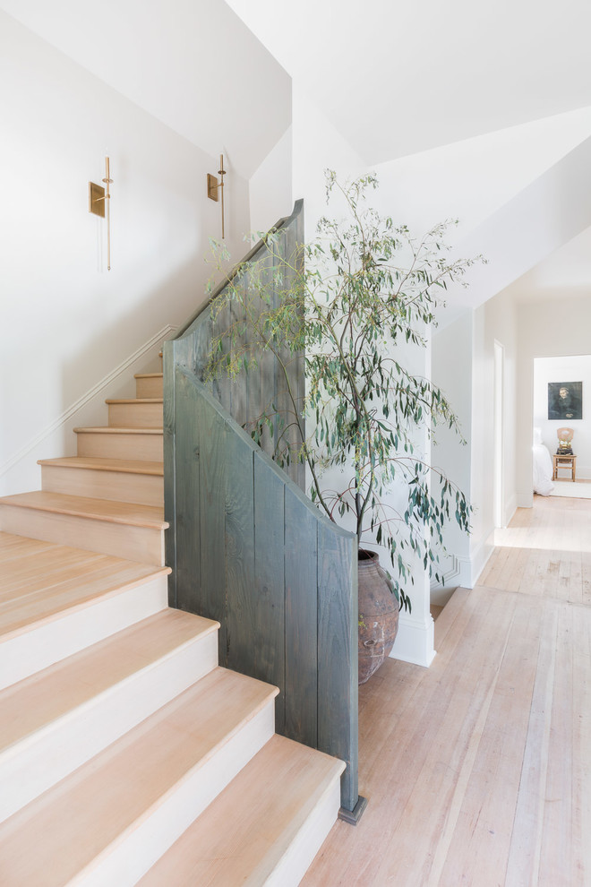 Inspiration for a country wood l-shaped staircase in Portland with wood risers and wood railing.