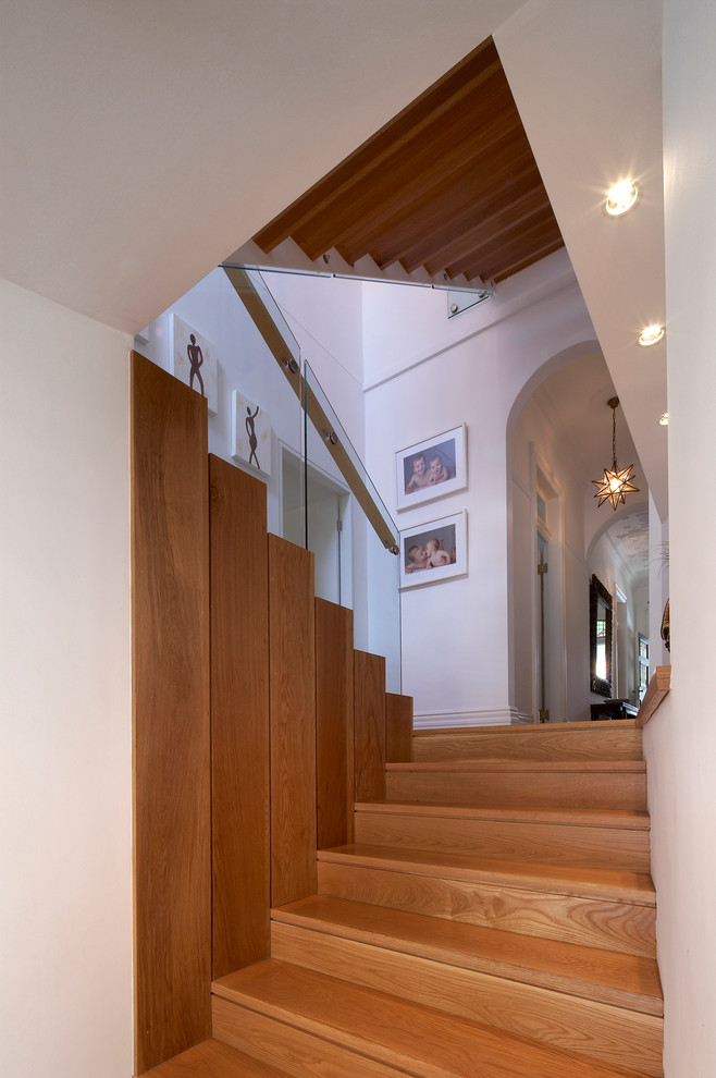Photo of a contemporary wood u-shaped staircase in Sydney with wood risers.