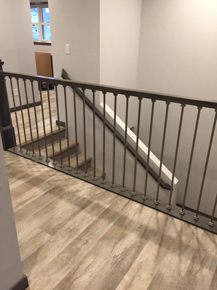 Hallway - mid-sized transitional gray floor hallway idea in Cedar Rapids with gray walls