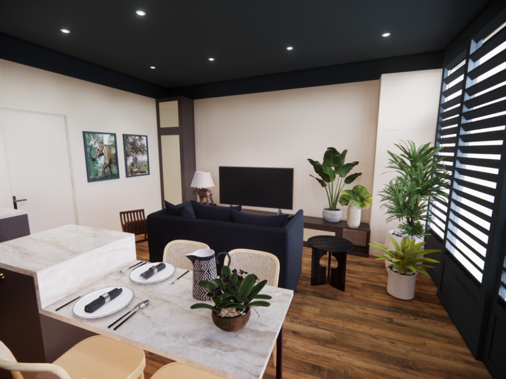 Kleines, Offenes Wohnzimmer mit beiger Wandfarbe, hellem Holzboden, freistehendem TV und braunem Boden in Sonstige
